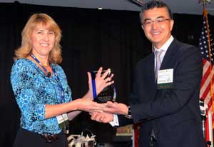 Haru Okuda, MD, SimLEARN National Medical Director, presents Denise Cochran, RN, BSN, with the 2012 Excellence in Clinical Simulation Training, Education and Research Practice Award